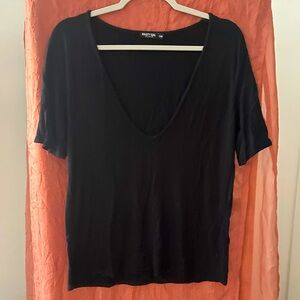 Nasty gal size s/m deep v black blouse.